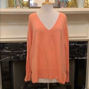 Never worn peach loose low v-neck sweater